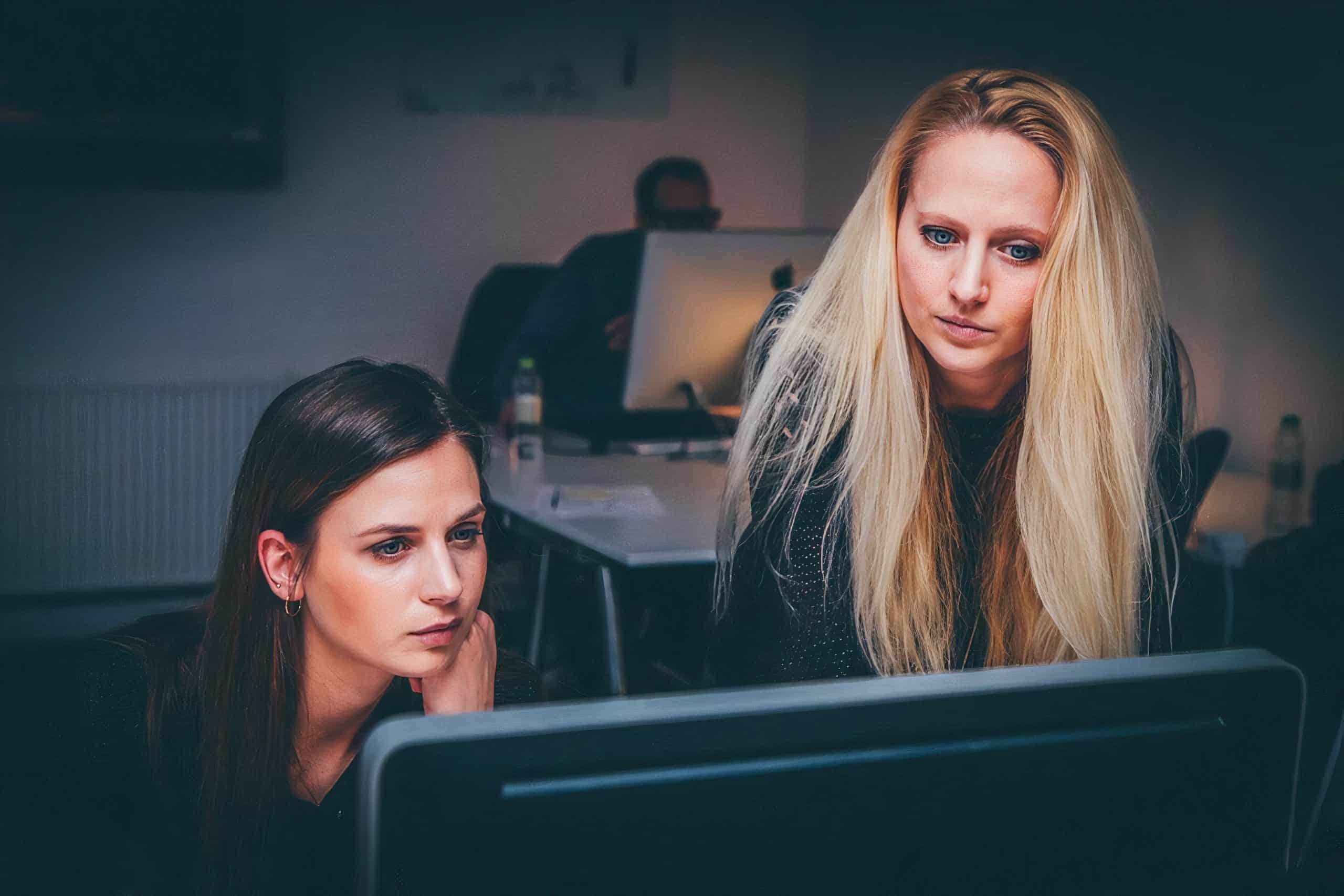 Employees looking at screen for more information
